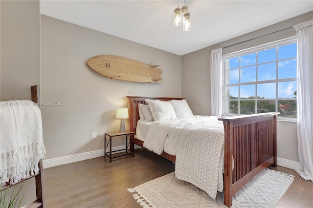 15201 SW 46th Ct, Miramar, FL 33027 - bedroom with wood finished floors and a textured ceiling