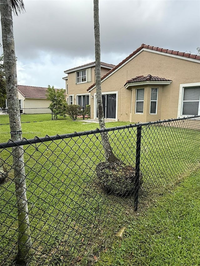 5657 NW 121st Ave, Coral Springs, FL 33076 - back of property featuring stucco siding and a tiled roof