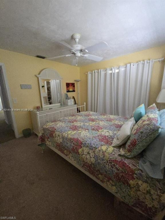 13001 Shetland Ln, Fort Myers, FL 33912 - bedroom featuring ceiling fan and carpet flooring