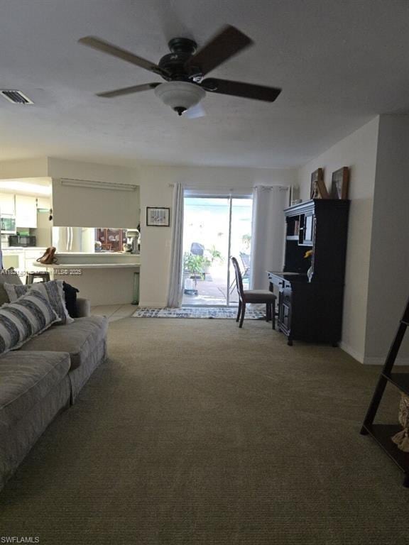13001 Shetland Ln, Fort Myers, FL 33912 - living room featuring ceiling fan and carpet floors