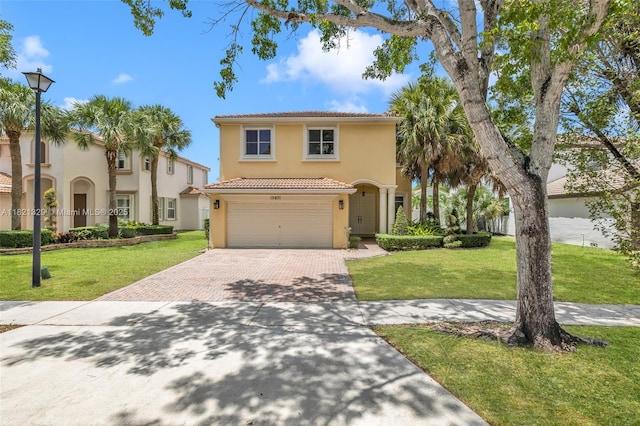 15631 SW 53rd St, Miramar, FL 33027 - mediterranean / spanish-style house featuring decorative driveway, a tiled roof, stucco siding, and a front lawn