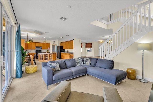 15631 SW 53rd St, Miramar, FL 33027 - living room featuring stairway and light tile patterned floors