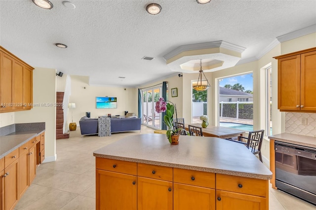 15631 SW 53rd St, Miramar, FL 33027 - kitchen with black dishwasher, open floor plan, tasteful backsplash, a textured ceiling, and light tile patterned floors
