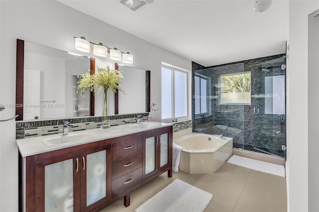 15631 SW 53rd St, Miramar, FL 33027 - bathroom featuring a bath, double vanity, a stall shower, backsplash, and tile patterned floors