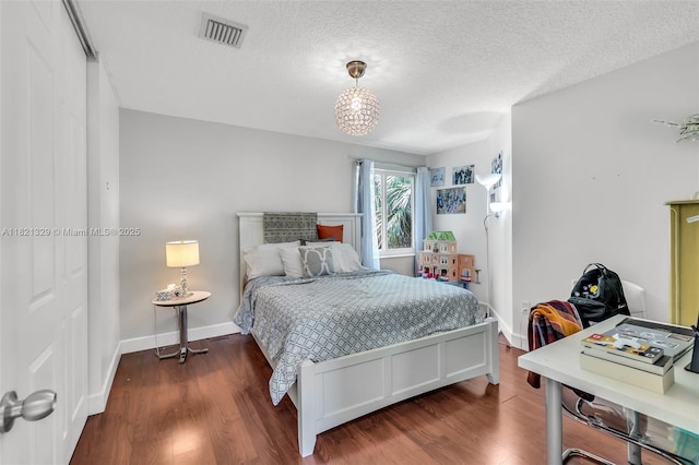 15631 SW 53rd St, Miramar, FL 33027 - bedroom with dark wood-type flooring and a textured ceiling
