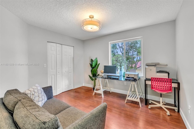 15631 SW 53rd St, Miramar, FL 33027 - office area featuring wood finished floors and a textured ceiling