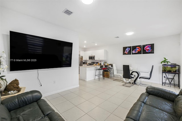23404 SW 131st Ave, Homestead, FL 33032 - living room with light tile patterned flooring and recessed lighting