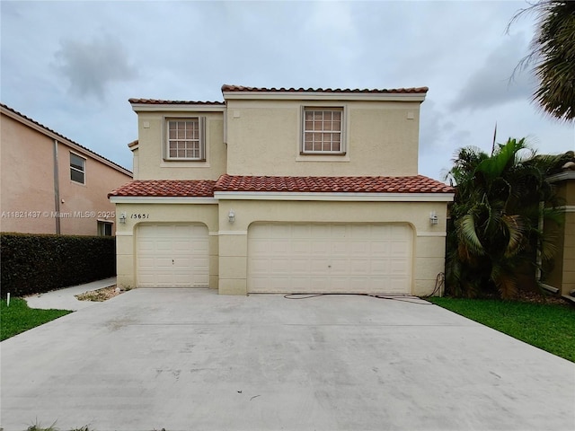 15651 NW 14th Ct, Pembroke Pines, FL 33028 - mediterranean / spanish-style home with an attached garage, stucco siding, driveway, and a tile roof