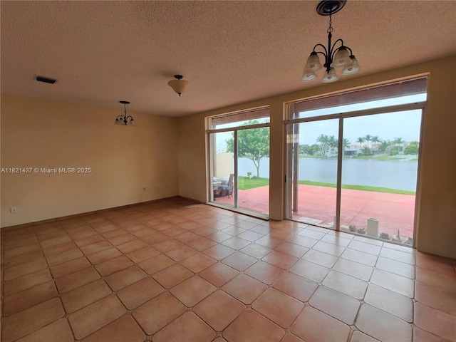 15651 NW 14th Ct, Pembroke Pines, FL 33028 - unfurnished room featuring a chandelier, a water view, a textured ceiling, and light tile patterned floors