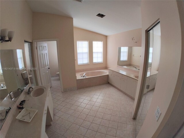 15651 NW 14th Ct, Pembroke Pines, FL 33028 - bathroom with lofted ceiling, a garden tub, tile patterned flooring, and vanity