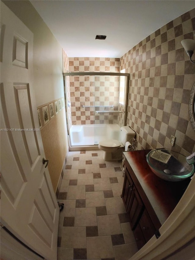 15651 NW 14th Ct, Pembroke Pines, FL 33028 - bathroom with shower / bath combination with glass door, tile walls, and vanity