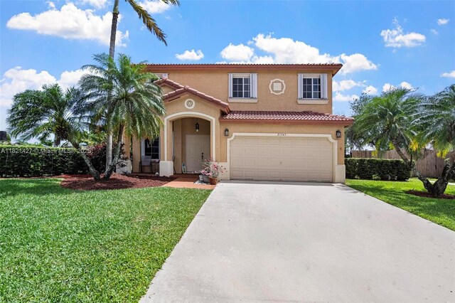 21343 SW 88th Ct, Cutler Bay, FL 33189 - mediterranean / spanish home featuring stucco siding, concrete driveway, a tiled roof, and a garage
