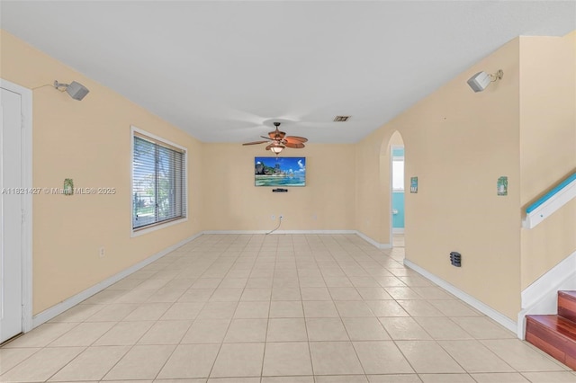 21343 SW 88th Ct, Cutler Bay, FL 33189 - spare room with plenty of natural light, arched walkways, ceiling fan, and stairs