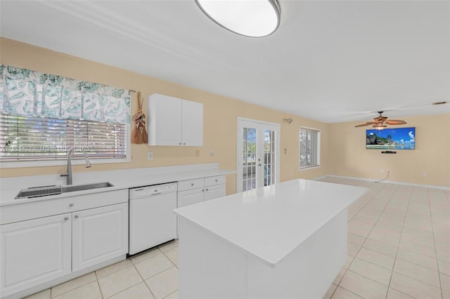 21343 SW 88th Ct, Cutler Bay, FL 33189 - kitchen with white dishwasher, french doors, light tile patterned floors, and white cabinets