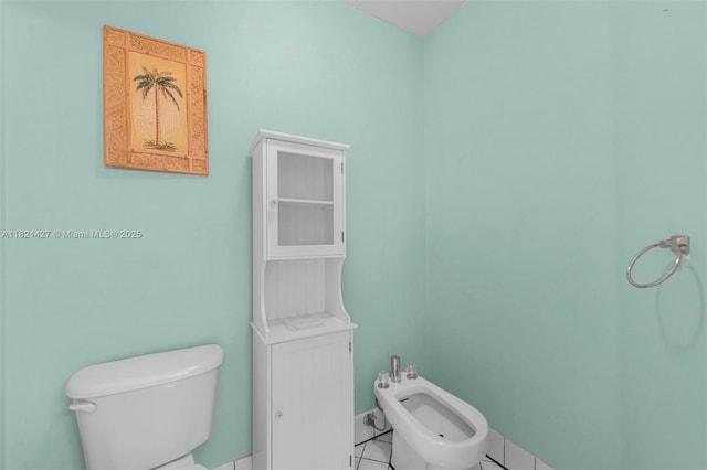 21343 SW 88th Ct, Cutler Bay, FL 33189 - bathroom with a bidet and tile patterned flooring