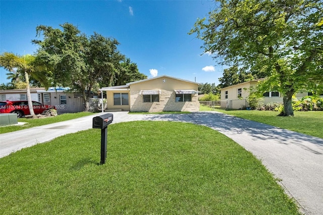 6428 Plunkett St, Hollywood, FL 33023 - view of front facade featuring curved driveway and stucco siding