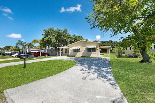 6428 Plunkett St, Hollywood, FL 33023 - ranch-style home with concrete driveway and stucco siding