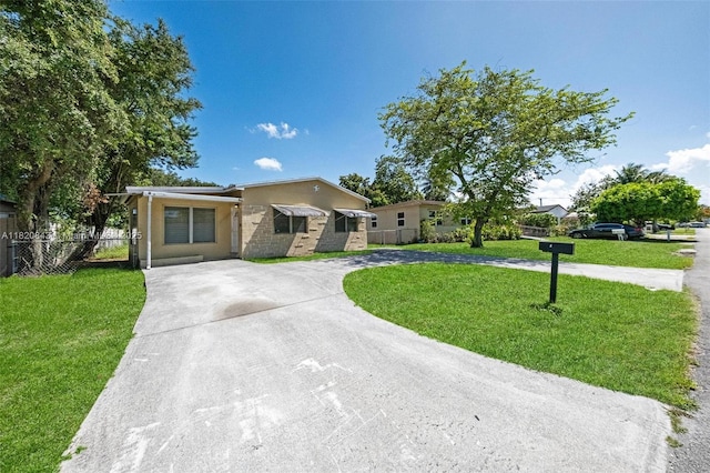 6428 Plunkett St, Hollywood, FL 33023 - ranch-style house with curved driveway and stucco siding