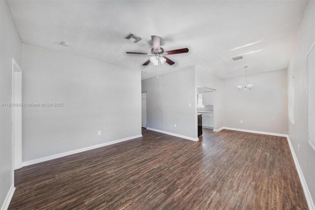 6428 Plunkett St, Hollywood, FL 33023 - unfurnished living room with a chandelier, dark wood finished floors, and a ceiling fan