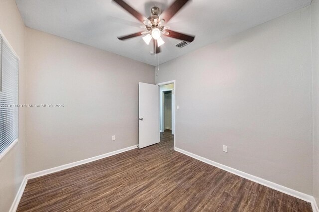 6428 Plunkett St, Hollywood, FL 33023 - unfurnished room featuring dark wood finished floors and a ceiling fan