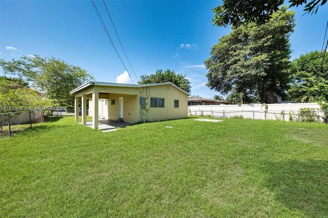 6428 Plunkett St, Hollywood, FL 33023 - rear view of house featuring a fenced backyard and stucco siding