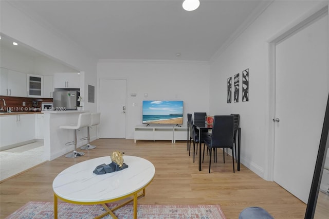 1200 Euclid Ave Unit 103, Miami Beach, FL 33139 - living area with ornamental molding, light wood finished floors, and electric panel