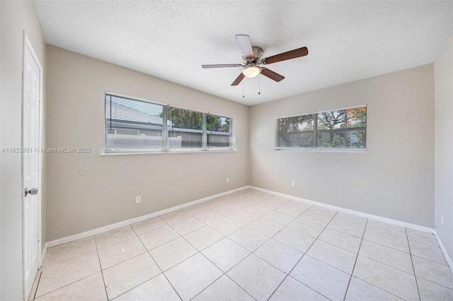 6442 Oak St, Hollywood, FL 33024 - unfurnished room featuring a textured ceiling, a ceiling fan, and light tile patterned floors
