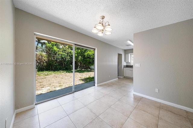6442 Oak St, Hollywood, FL 33024 - unfurnished dining area with a chandelier, a textured ceiling, and light tile patterned flooring