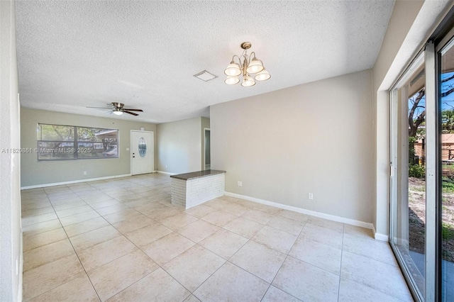 6442 Oak St, Hollywood, FL 33024 - unfurnished room featuring a textured ceiling, light tile patterned floors, a chandelier, and ceiling fan