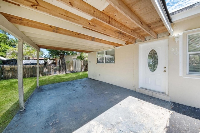 6442 Oak St, Hollywood, FL 33024 - doorway to property with a patio, a carport, and stucco siding