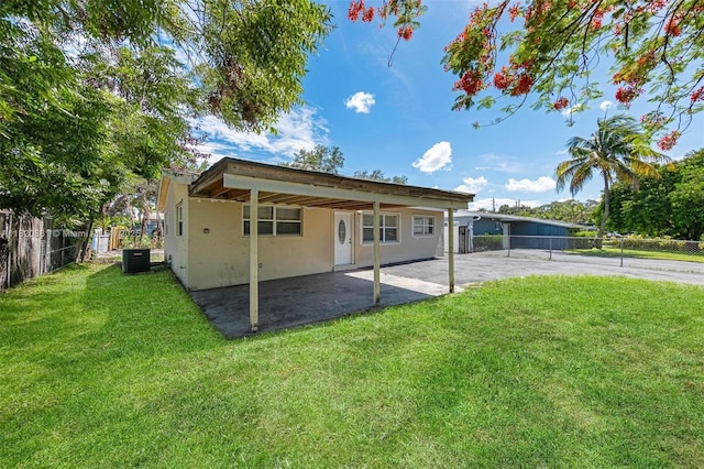 6442 Oak St, Hollywood, FL 33024 - back of house with stucco siding and a patio area