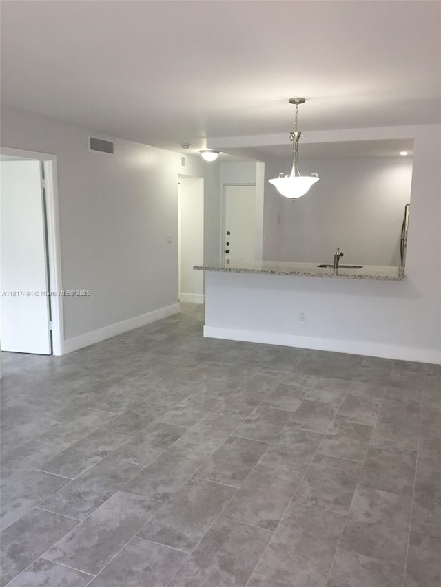 7840 Camino Real Unit P312, Miami, FL 33143 - unfurnished living room with a sink and baseboards
