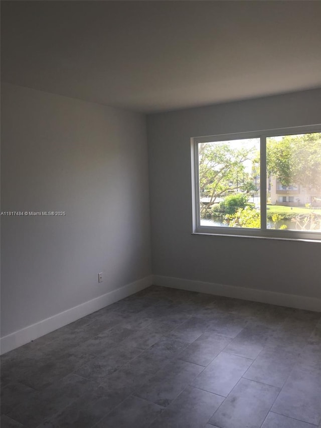 7840 Camino Real Unit P312, Miami, FL 33143 - empty room featuring baseboards