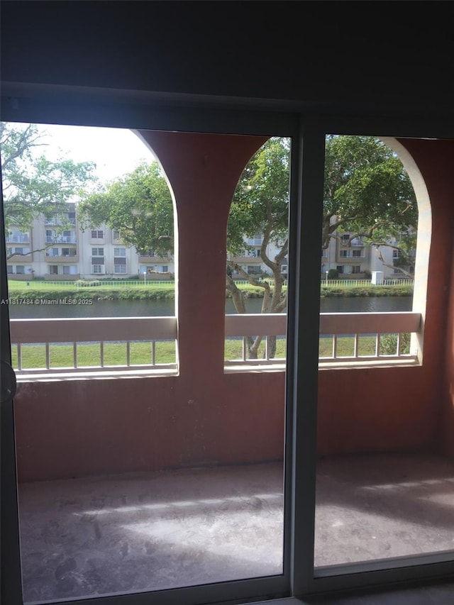 7840 Camino Real Unit P312, Miami, FL 33143 - unfurnished sunroom featuring a water view and plenty of natural light