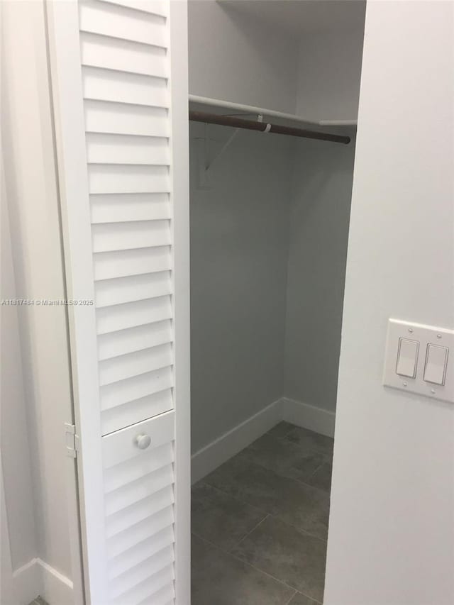 7840 Camino Real Unit P312, Miami, FL 33143 - spacious closet with dark tile patterned floors