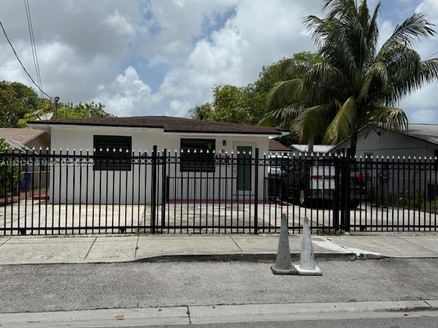 67 NW 34th St, Miami, FL 33127 - gate with a fenced front yard