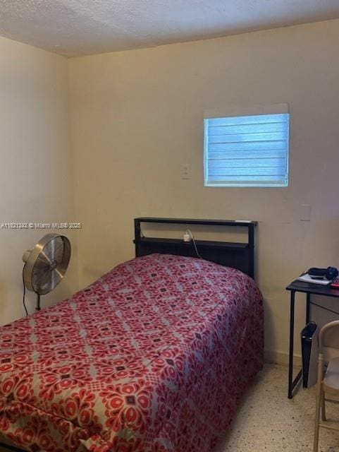 67 NW 34th St, Miami, FL 33127 - bedroom with baseboards and a textured ceiling