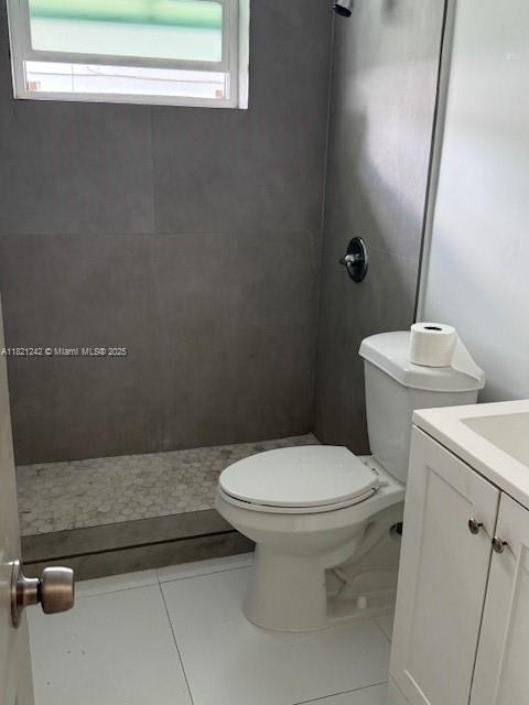 67 NW 34th St, Miami, FL 33127 - full bath with healthy amount of natural light, vanity, and tile patterned floors