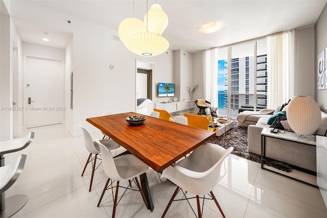 15901 Collins Ave Unit 3302, Sunny Isles Beach, FL 33160 - dining room with expansive windows and light tile patterned floors