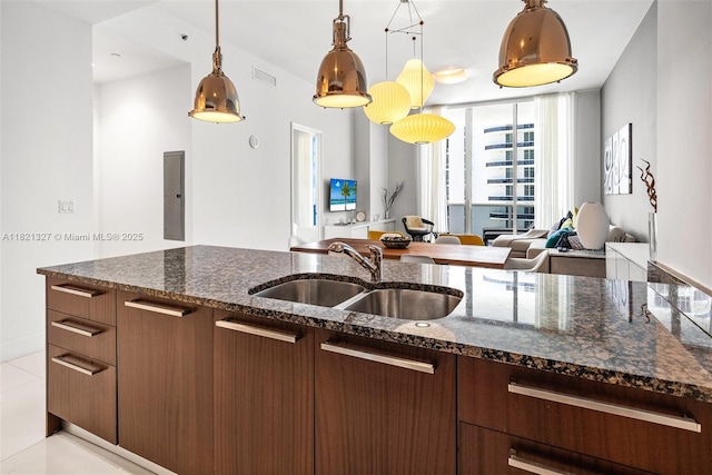 15901 Collins Ave Unit 3302, Sunny Isles Beach, FL 33160 - kitchen with open floor plan, electric panel, pendant lighting, dark stone counters, and floor to ceiling windows