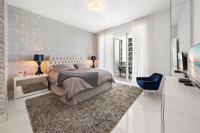 15901 Collins Ave Unit 3302, Sunny Isles Beach, FL 33160 - bedroom featuring wallpapered walls, tile patterned flooring, and access to outside