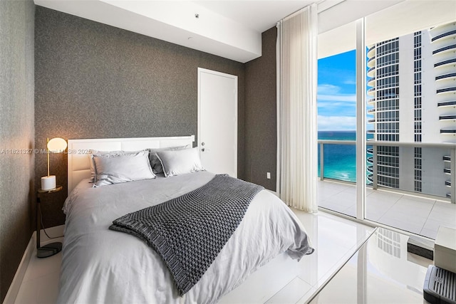 15901 Collins Ave Unit 3302, Sunny Isles Beach, FL 33160 - bedroom featuring a water view and a wall of windows