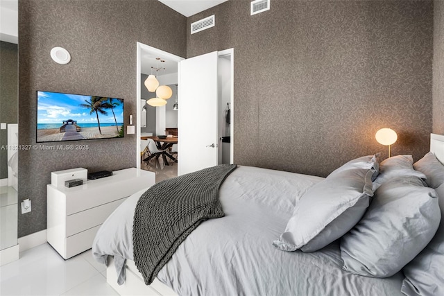15901 Collins Ave Unit 3302, Sunny Isles Beach, FL 33160 - bedroom with wallpapered walls, tile patterned floors, and a towering ceiling