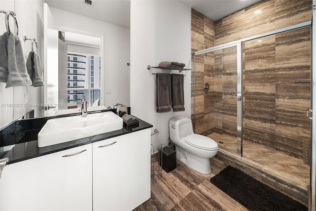 15901 Collins Ave Unit 3302, Sunny Isles Beach, FL 33160 - full bathroom featuring vanity, a stall shower, and wood finished floors