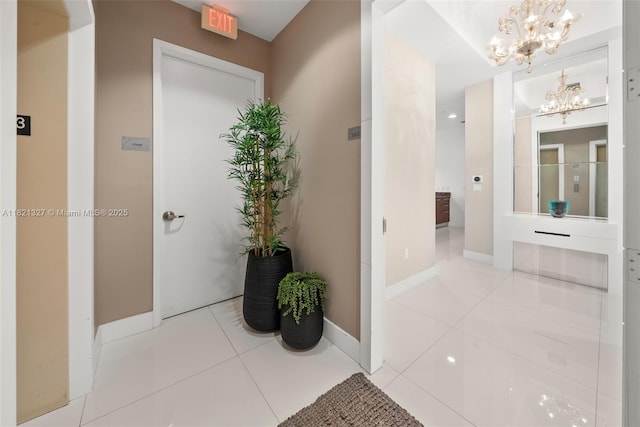 15901 Collins Ave Unit 3302, Sunny Isles Beach, FL 33160 - hall featuring a chandelier and tile patterned flooring