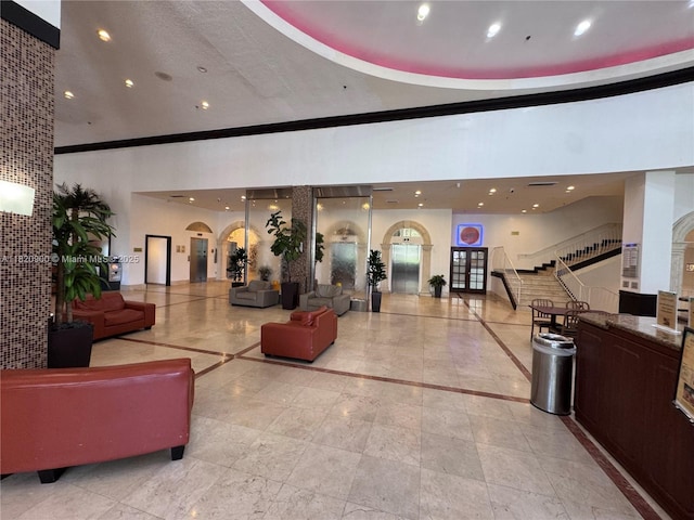19201 N Collins Ave Unit 826, Sunny Isles Beach, FL 33160 - building lobby featuring stairway, crown molding, and recessed lighting