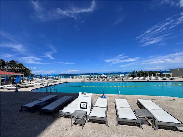 19201 N Collins Ave Unit 826, Sunny Isles Beach, FL 33160 - community pool with a water view and a patio