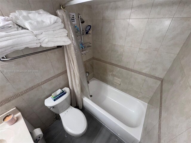 19201 N Collins Ave Unit 826, Sunny Isles Beach, FL 33160 - bathroom featuring tile walls and shower / bath combo with shower curtain