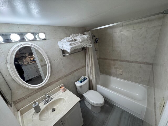 19201 N Collins Ave Unit 826, Sunny Isles Beach, FL 33160 - full bath with vanity, tile walls, shower / tub combo, and wood finished floors