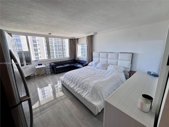 19201 N Collins Ave Unit 826, Sunny Isles Beach, FL 33160 - bedroom with a textured ceiling, wood finished floors, and ornamental molding